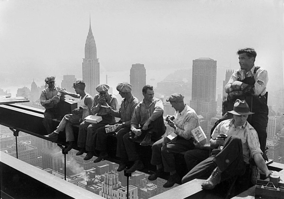 Lunch atop a Skyscraper, 1932. Steel workers eating lunch on a beam high above New York City during construction of 30 Rockefeller Plaza.